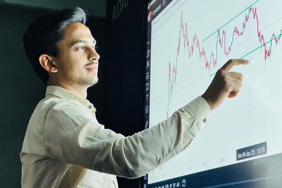Instructor explaining a chart on a large screen