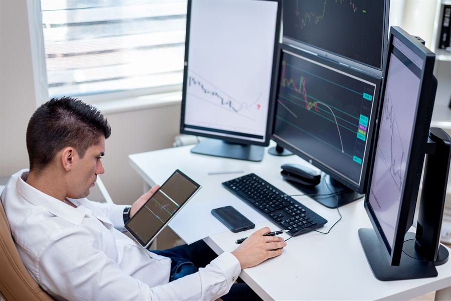 A trading desk with multiple monitors